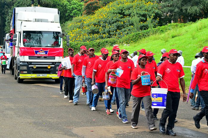 A photo Crown Paints staff marching past the Uhuru Park dias during a past Labour Day celebration - Photo/Crown Paints PLC