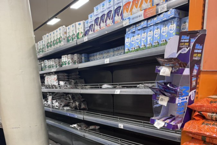 Empty shelves at a supermarket as shoppers face limited supplies of fresh milk. (Image: UGC)