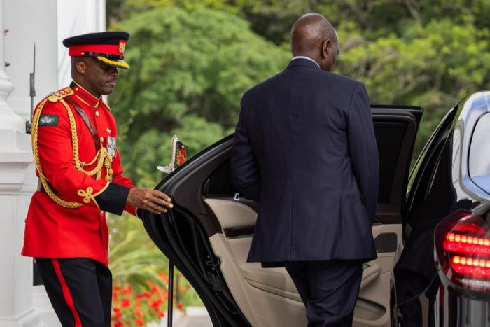 President William Ruto entering a car