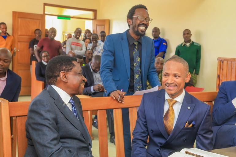 Senior Counsel James Orengo shares a light moment with Hon. Babu Owino at the Kajiado Law Court during Bob Njagi's case (Image: Files)