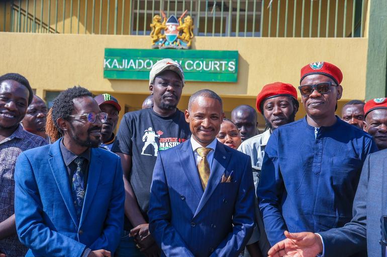 Activist Bob Njagi alongside his defense team led by Hon. Babu Owino outside Kajiado Law Courts after the treason charges were dismissed (Image: Files)