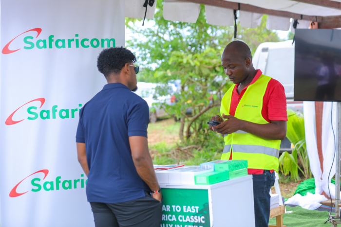 A Safaricom agent helping a subscriber. (Image: Safaricom)