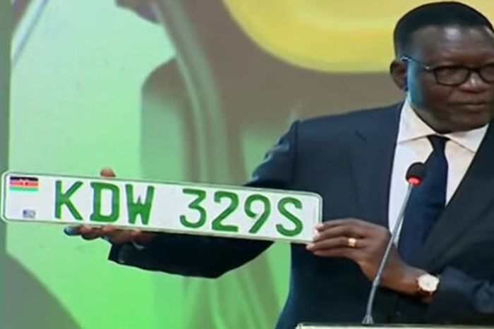 Transport Cabinet Secretary Davis Chirchir displays new green number plates for electric vehicles