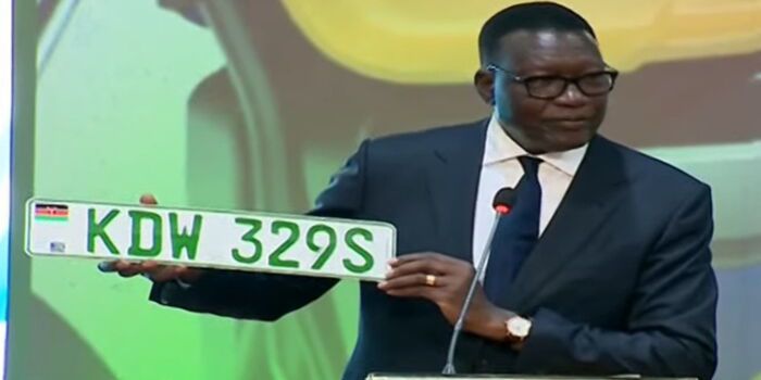 Transport Cabinet Secretary Davis Chirchir displays new green number plates for electric vehicles