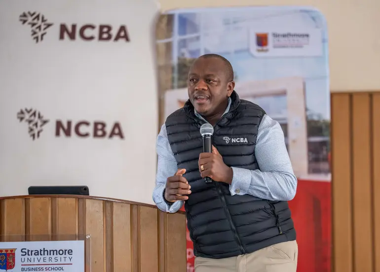 NCBA Group Director of Retail Banking Dennis Njau speaks at a recent banking seminar in Nairobi (Image: Files)