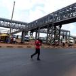 A person crossing the road instead of using a footbridge