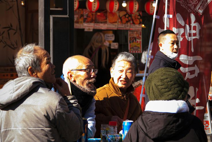 A group of elderly Japanese people in conversation