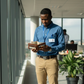 An AI illustration of a Kenyan employee looking at their wallet