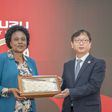 Koji Nakamura, Senior Executive Officer, International Sales Division, Isuzu Motors, gifts Isuzu EA Chair of the Board and Managing Director Rita Kavashe during the Isuzu EA 50th Anniversary celebrations