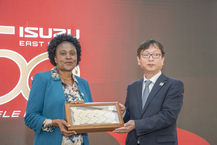 Koji Nakamura, Senior Executive Officer, International Sales Division, Isuzu Motors, gifts Isuzu EA Chair of the Board and Managing Director Rita Kavashe during the Isuzu EA 50th Anniversary celebrations