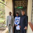 Kaluma Boy being admitted to University accompanied by Bishop Muthee Kiengei (in black suit)