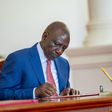 President William Ruto signing a bill into law