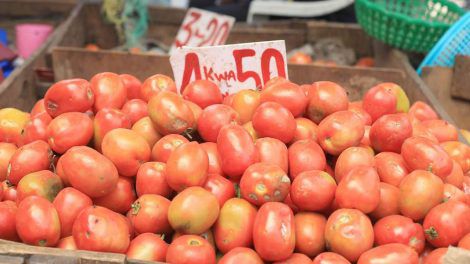 A photo of tomatoes in the market