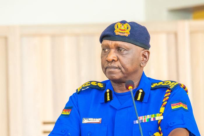 Inspector General Douglas Kanja Kirocho addressing a press briefing on road safety measures during the December 2024 festive season, wearing a National Police Service uniform. He has deloyed NTSA, undercover officers, specialised units
