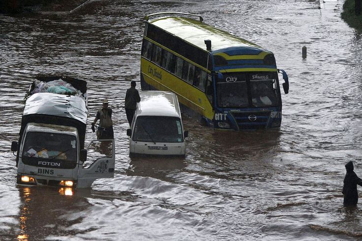 Vehicles partially submerged in floodwater following heavy rains in Nairobi, Kenya