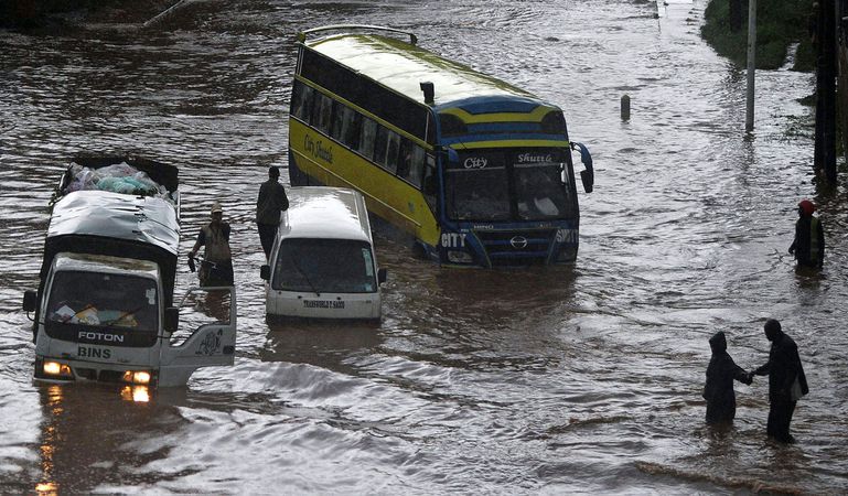 Vehicles partially submerged in floodwater following heavy rains in Nairobi, Kenya