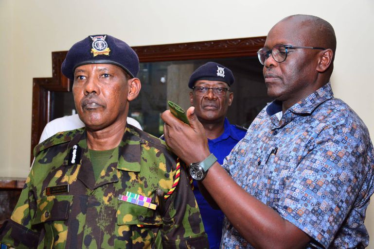 Coast Regional Commander Ali Nuno Dubat (left) is promoted to Assistant Inspector-General of Police by Deputy Inspector-General Eliud Lagat (right) in March 2025