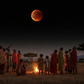 AI-generated photo of Africans looking up at the sky watching a lunar eclipse at night