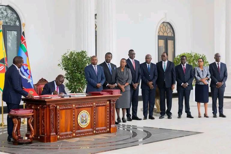 The Deputy President Kithure Kindiki and Cabinet Secretaries stand witness as President Ruto signs four new bills into law at State House, Nairobi on 08th September 2026 (Image: Files)