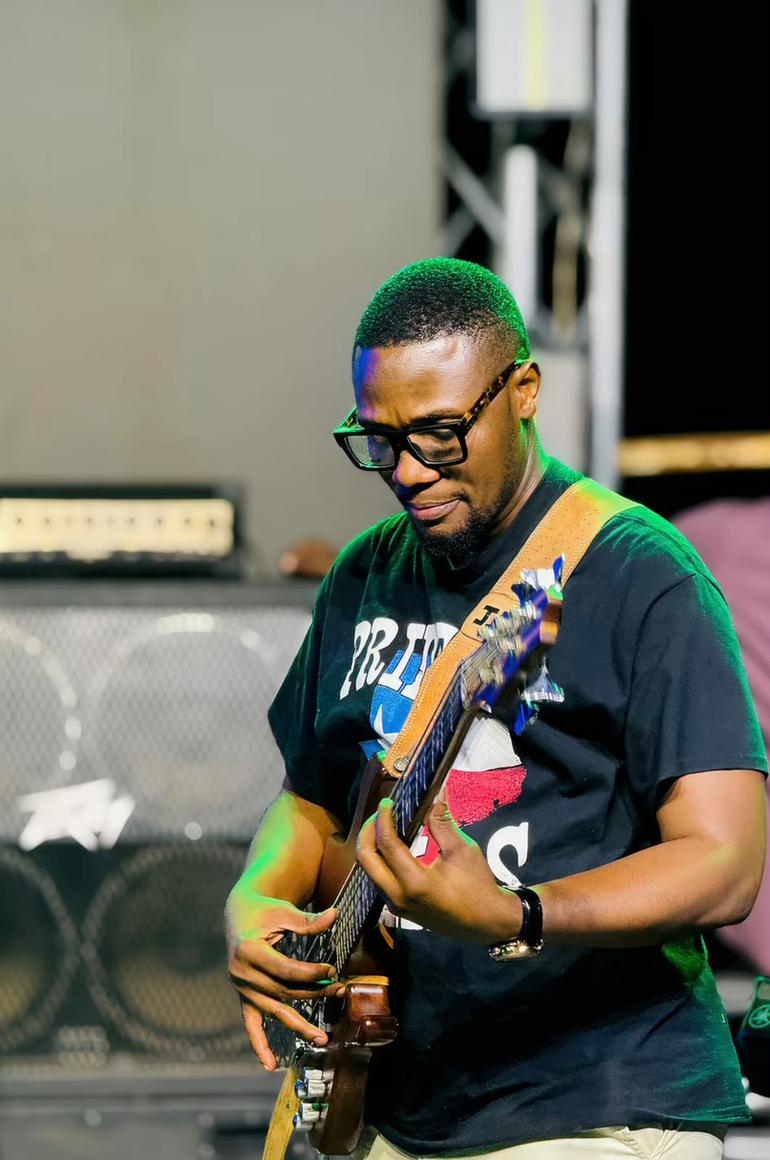 Agape Gospel Band's JP on the bass guitar