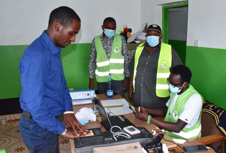 Independent Electoral and Boundaries Commission officials registering a voter.
