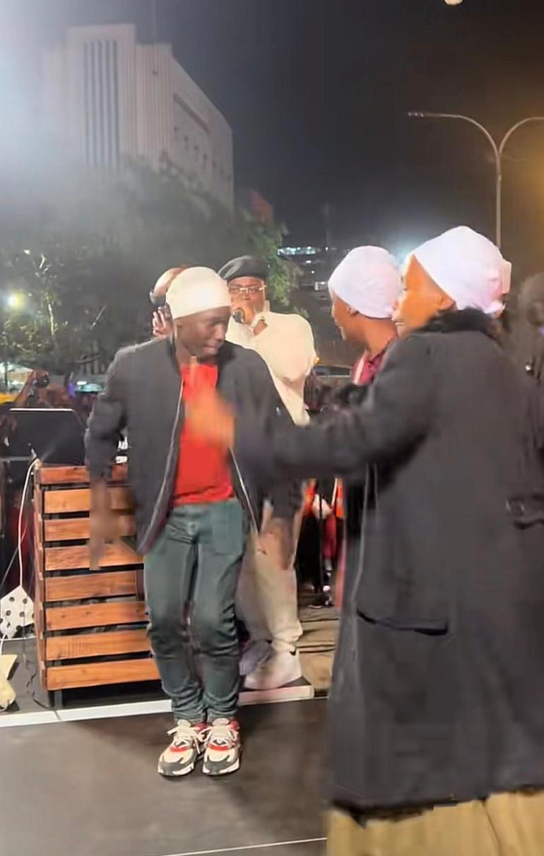 Members of the Akorino dance on stage outside the Kenya National Archives in Nairobi.