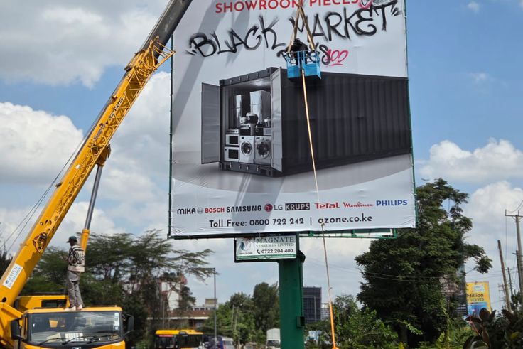 Shock as daring Nairobi man vandalises billboard in broad daylight