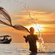 A fisherman casting his net