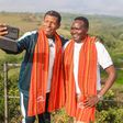 Ethiopian Athletics legend Haile Gebrselassie (L) and his Kenyan counterpart Paul Tergat take a selfie during their tour of the Nairobi National Park