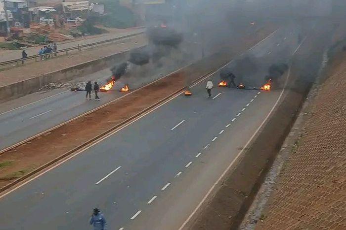 A blocked section of the Southern Bypass after unknown groups lit fires in the road
