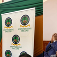 Photo collage of a HELB banner and National Assembly Majority Leader Kimani Ichung’wah