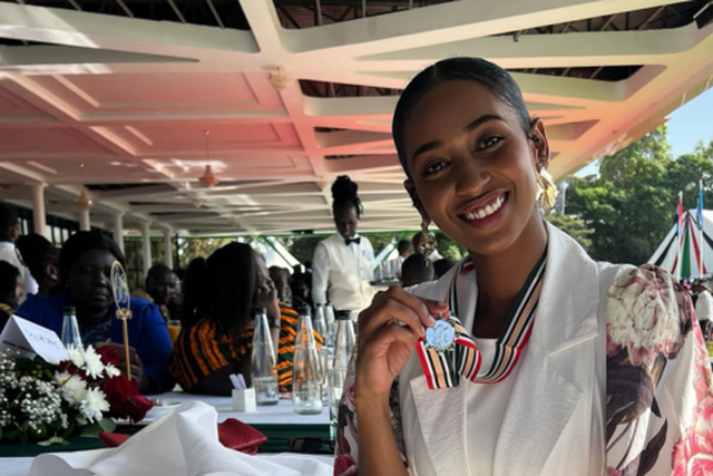 Sarah Hassan shows off her OGW medal awarded by President William Ruto during a luncheon at State House, Nairobi