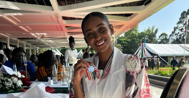 Sarah Hassan shows off her OGW medal awarded by President William Ruto during a luncheon at State House, Nairobi