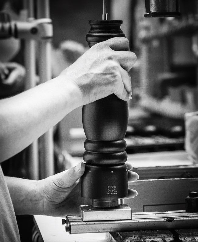 A chef using a Peugeot Saveurs kitchen product
