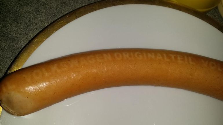 A Volkswagen sausage, branded 'Volkswagen Originalteil', which translates to 'Original Volkswagen Part'. This sausage is officially classified as a vehicle component.