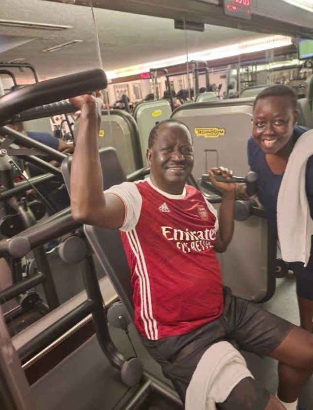 The late former Prime Minister Raila Odinga works out while wearing an Arsenal jersey, pictured here alongside his sister Ruth Odinga
