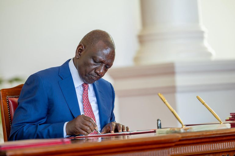 President William Ruto signs a bill into law at State House, Nairobi