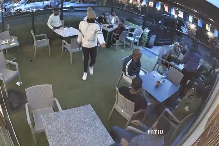 A CCTV screengrab shows a suspect mugging people in restuarant in Spring Valley