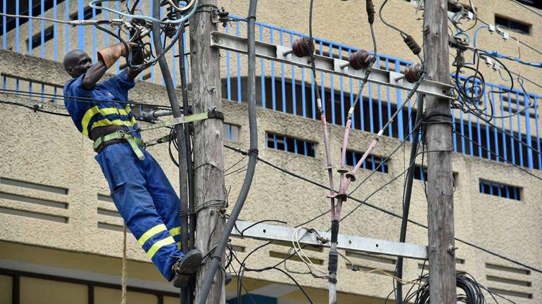 A Kenya Power personnel at work