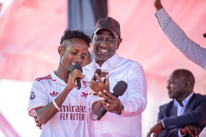 President William Ruto interacting with a NYOTA program beneficiary