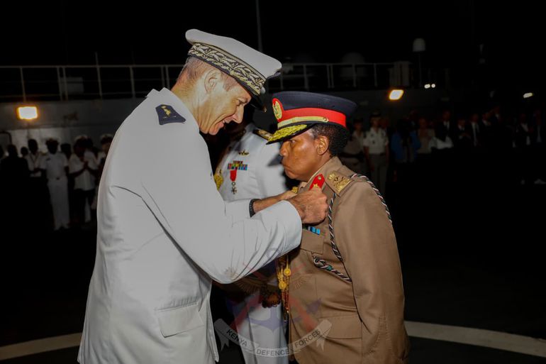 Major General Joyce Sitienei, Deputy Vice-Chancellor at the Centre for Strategic and Security Studies of the National Defence University-Kenya, receives the National Defence Medal at Gold Level aboard the DIXMUDE