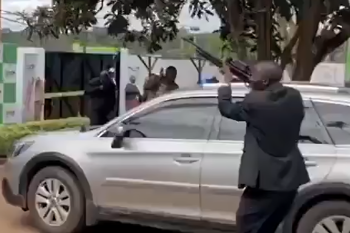 A man seen firing a gun in the air during the launch of Rigathi Gachagua's DCP party