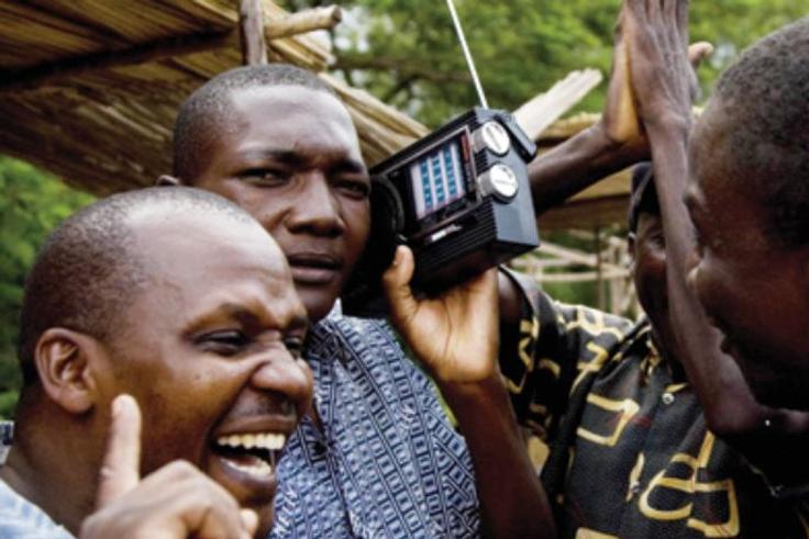 People listening to a radio