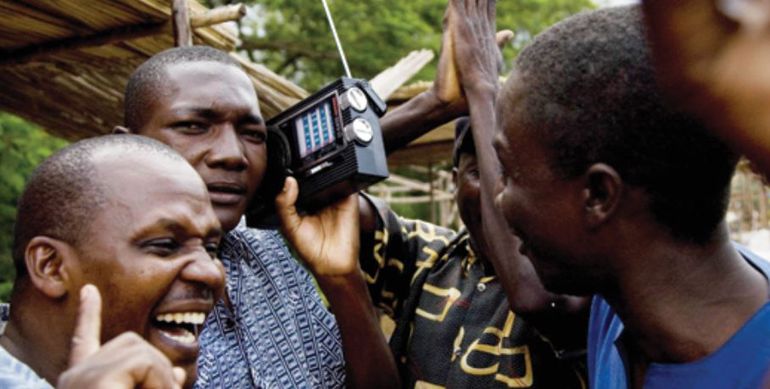 People listening to a radio