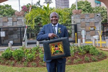 National Treasury Cabinet Secretary John Mbadi lifts the budget briefcase at the National Treasury ahead of the Budget 2026/27 statement in Parliament.