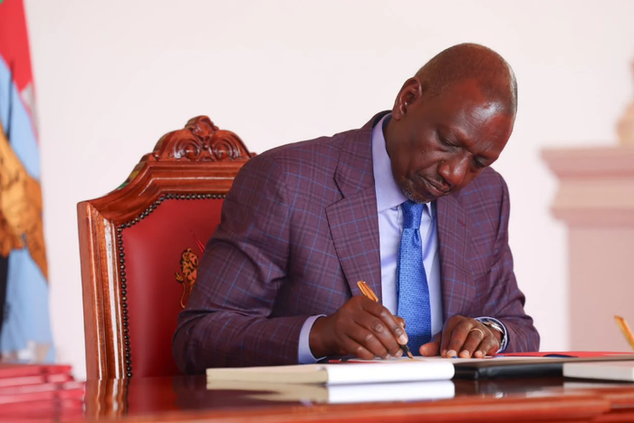 President William Ruto signing a Bill into law
