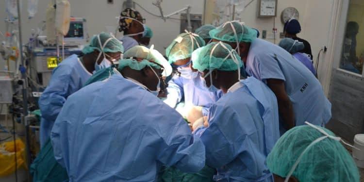 An image of doctors performing a surgery on a patient