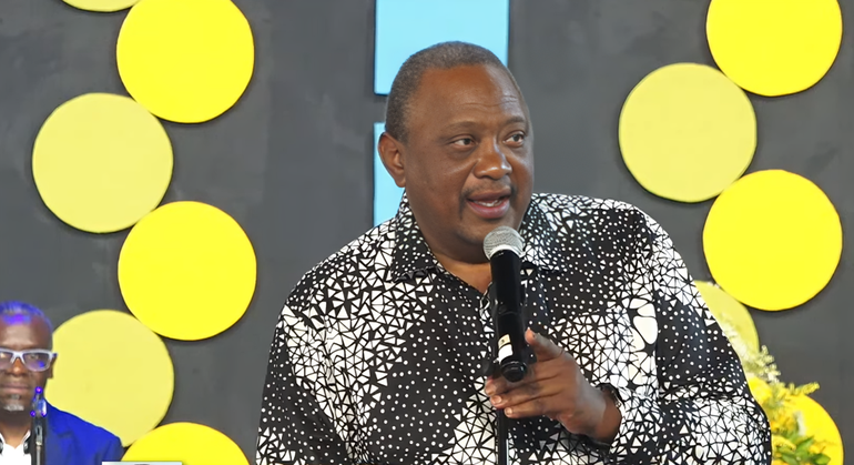 Former President Uhuru Kenyatta speaking during the burial of his cousin, Kibathi Muigai