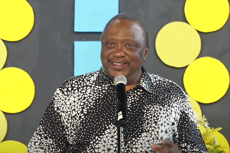 Former President Uhuru Kenyatta speaking during the burial of his cousin, Kibathi Muigai