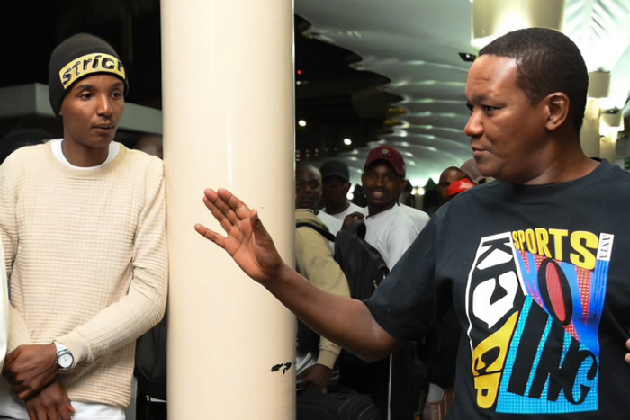 Labour and Social Protection Cabinet Secretary Alfred Mutua seeing off Kenyans at JKIA